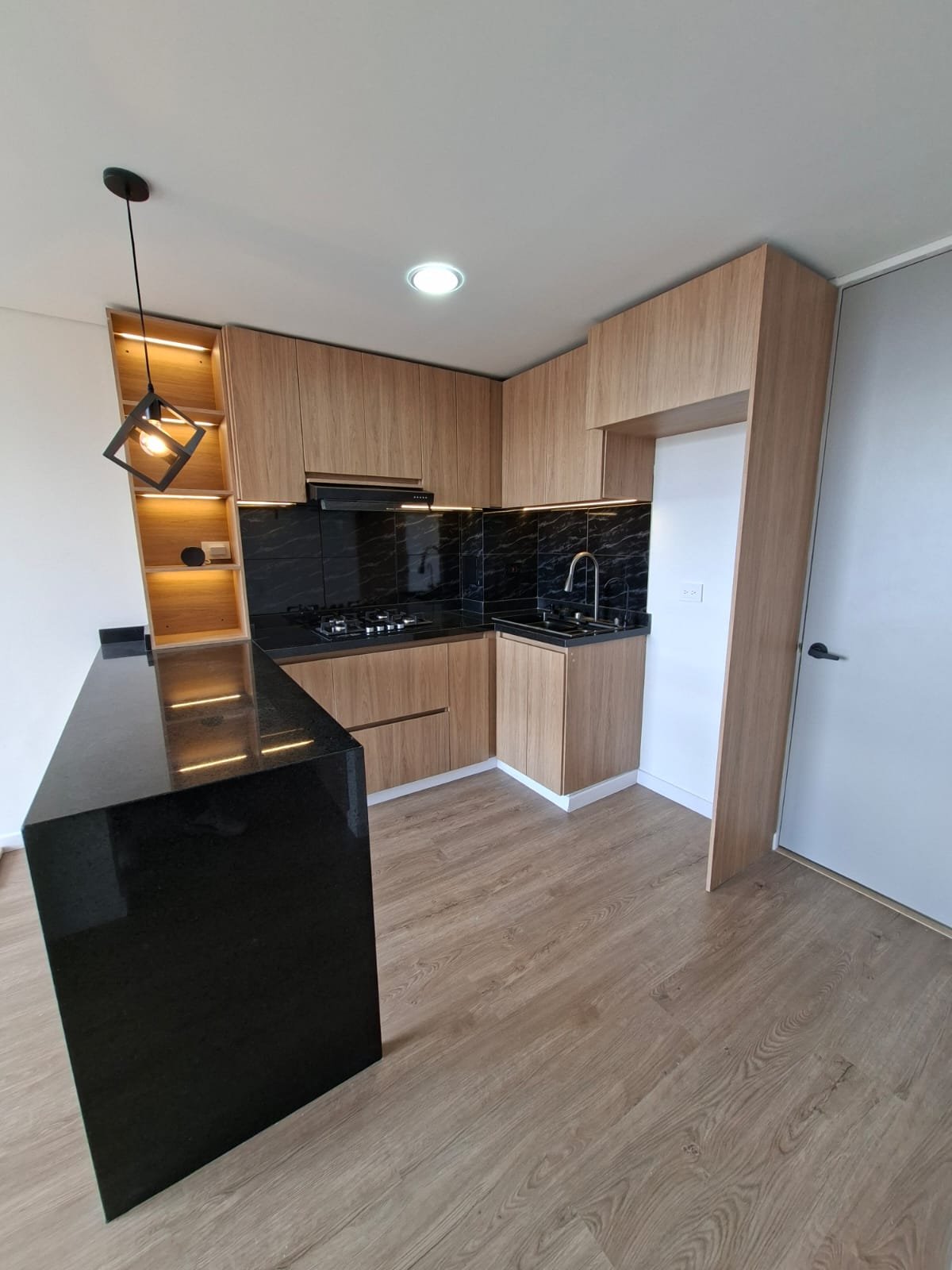 Apartamento Bogotá — acabados en madera